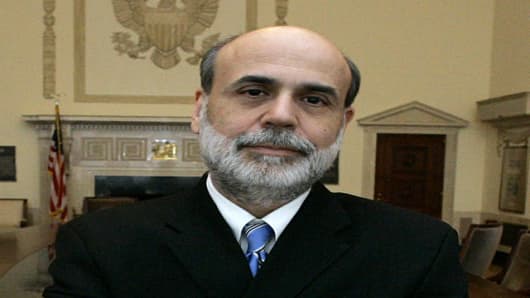 Federal Reserve Board Chairman Ben Bernanke poses in the board room of Federal Reserve headquarters Friday, Jan 26, 2007, in Washington. Bernanke and his colleagues gather Tuesday, Jan. 30, 2007, for a two-day meeting to discuss what is needed to keep the economy on track and improve the central bank's communications with Wall Street and Main Street. (AP Photo/Manuel Balce Ceneta)